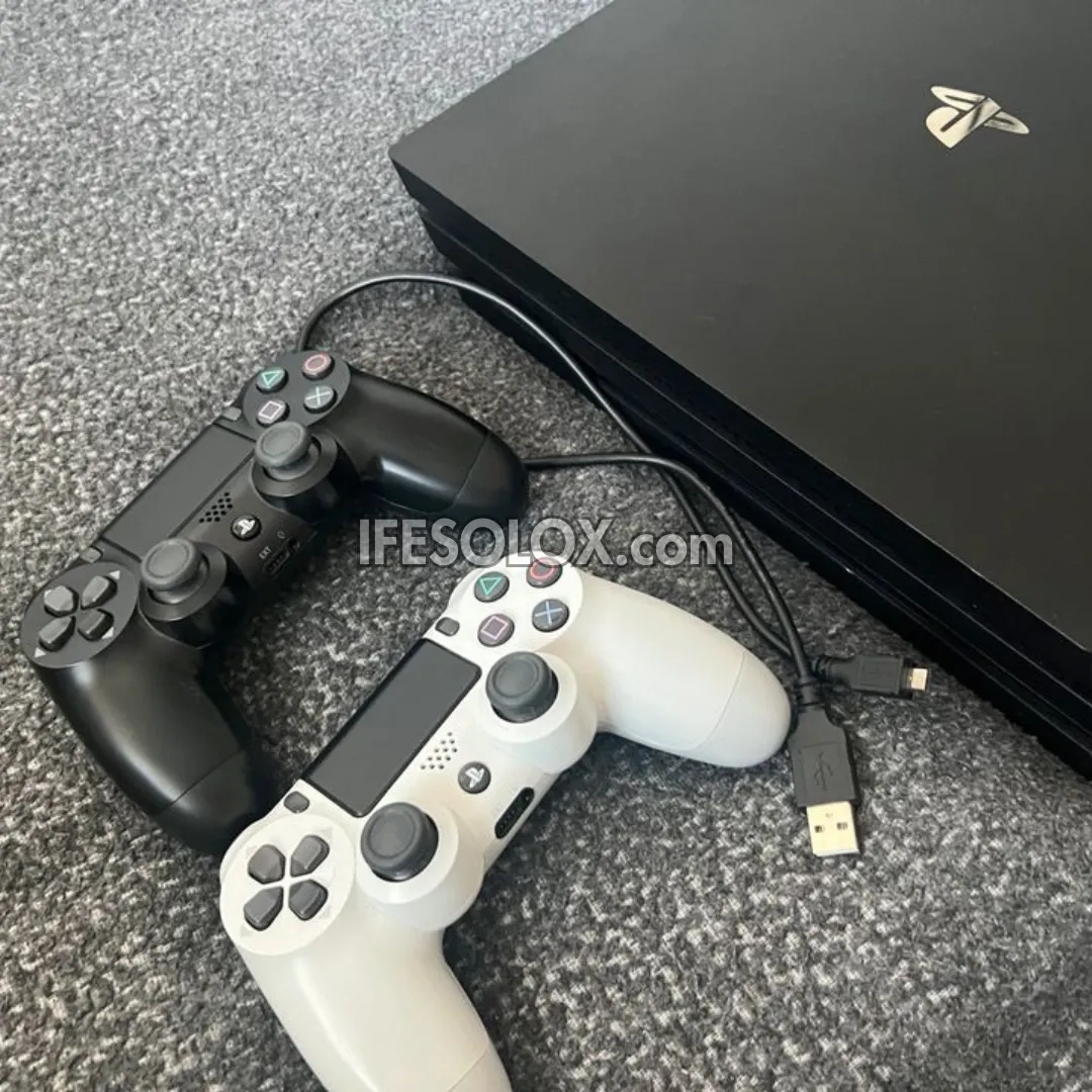 Sony Playstation 4 (PS4) 1TB Game Console with 2 DUALSHOCK 4 Controllers and 10 Games - Foreign Used